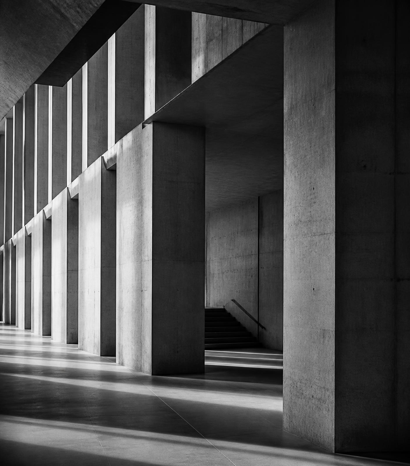 Architectural interior of a modern institutional building in black and white